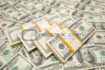 Ten thousand dollar stacks on money background