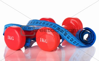 Dumbbells and measuring tape