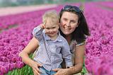 In Tulip Field. Mother with son in tulips field