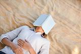 Woman sleeping with her book