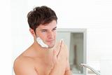 Handsome caucasian man ready to shave in the bathroom