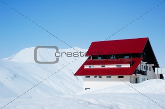 Lonely house in bright sunny winter day