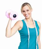 Young woman holdng a dumbbell 