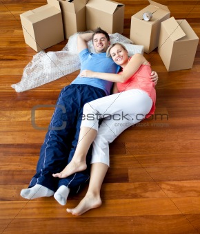 Young couple lying on floor