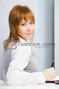 portrait of an attractive girl with a notebook
