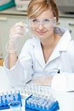 Self-assured caucasian female scientist holding samples