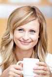 Smiling businesswoman holding a cup of coffee