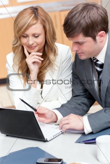 Two businesspeople working on a presentation
