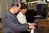 Senior couple playing the piano