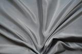 Smooth elegant silvery grey silk as background 