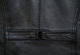 Detail of a black leather waistcoat