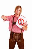Disapointed Bavarian man in lederhose disagrees to non-smoking-rule