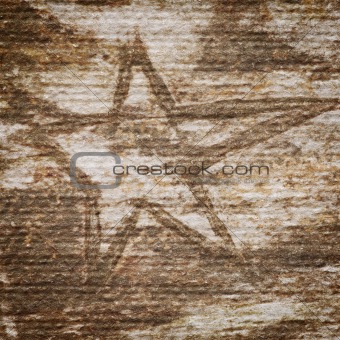 Grungy star on a handmade paper texture 