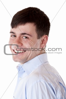 Young handsome man smiles happy at camera