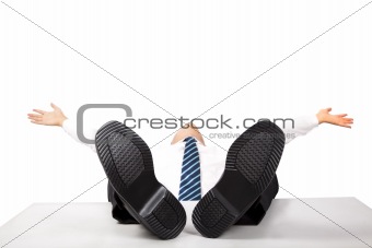 Relaxing business man with feet up on the desk