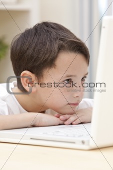 Boy Child Using Laptop Computer Resting on His Hands