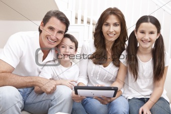 Happy Family Having Fun Using Tablet Computer At Home
