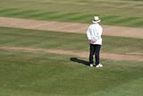Cricket umpire alone