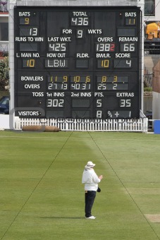 Cricket umpire and scoreboard