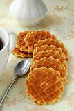 cup of black coffee and Belgian waffles for dessert