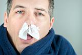 Man With Tissue In Nose