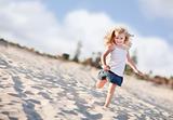 Adorable Little Girl Having Fun at the Beach One Sunny Afternoon.