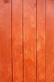 Parallel wooden planks, painted in red