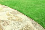 Garden stone path with grass 