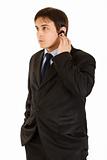 Concentrated modern businessman with handsfree
