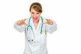 Angry medical doctor woman with stethoscope wants to catch you
