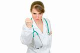 Angry medical doctor woman threaten with fist
