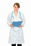 Smiling  doctor woman holding medical chart in hand
