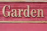 Red wooded garden sign