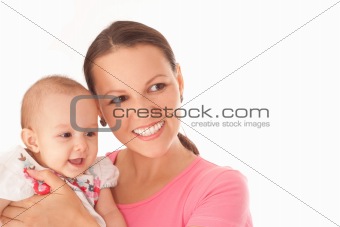 mother stands and holds the baby