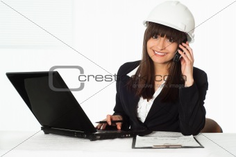 girl sitting in the construction helmet 