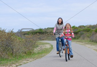 Mother with children on their bikes