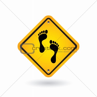 yellow sign with foot