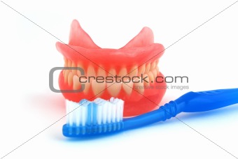 dentures and toothbrush
