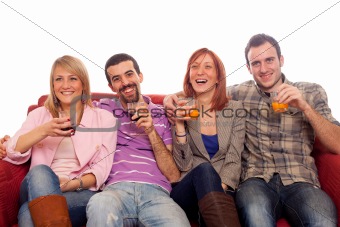 Young Group Sitting on Sofa and Drinking