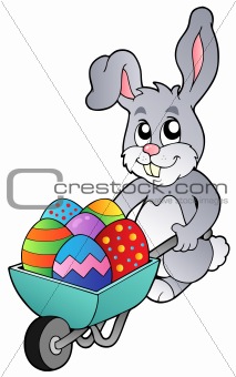 Bunny holding wheelbarrow with eggs