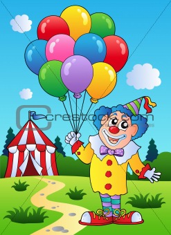 Clown with balloons near tent