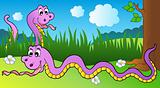 Two cartoon snakes on meadow