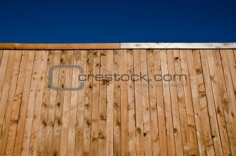 Wooden fence with blue sky