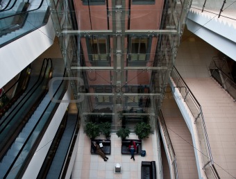 glass elevator shaft in a modern office building