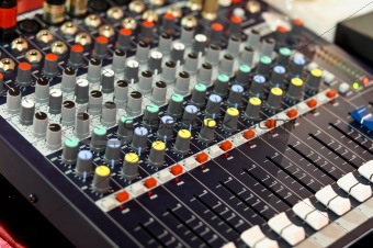 mixer buttons equipment in audio recording studio