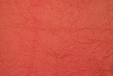 Background of Crumbled Paper a red color