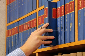 bookcase and hand