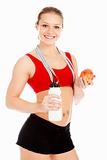 Smiling sports woman with an apple, measure tape and bottle