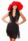 beautiful young woman in black dress and red hat