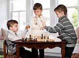 Twin brothers playing chess game